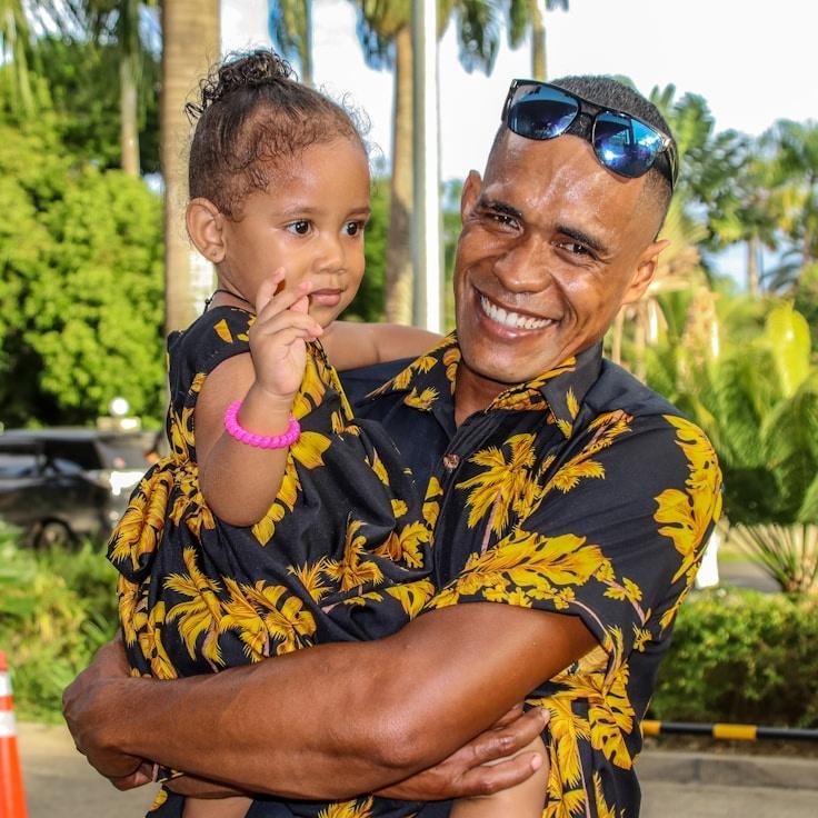 Jordan Reed, Lead Design Curator at Celestial Flow Center, reviewing corporate floral arrangements